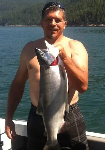 Denis Woodcox holds world record Kokanee salmon (landlocked sockeye).