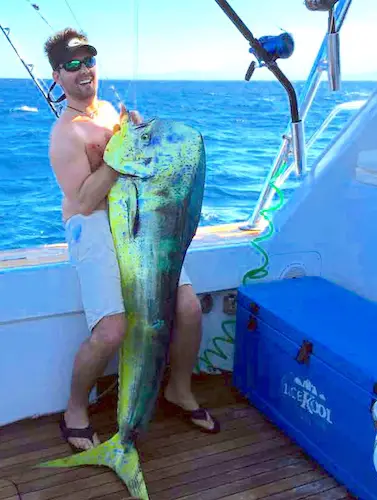 World record mahi-mahi that went unweighed on an official scale in 2015. Brian Lindsey holding what was likely a world-record smashing mahi-mahi fish.
