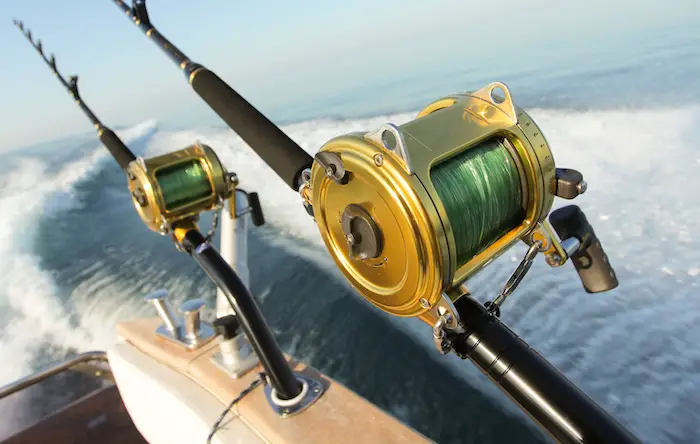 Two big baitcasting reels and heavy-weight grouper fishing rods for catching big grouper in the 100 lb. range.