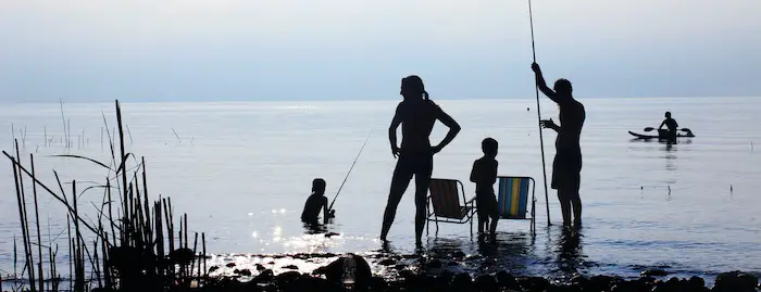 Family fishing from shore in South Florida.