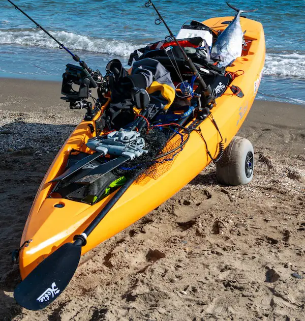 Kayak cart (dolly wheels) with wheels for transporting kayak easily over sand to the water.
