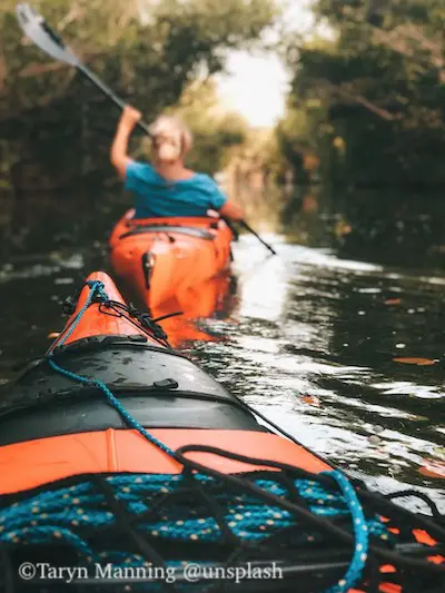 River kayaking while fishing in Florida.